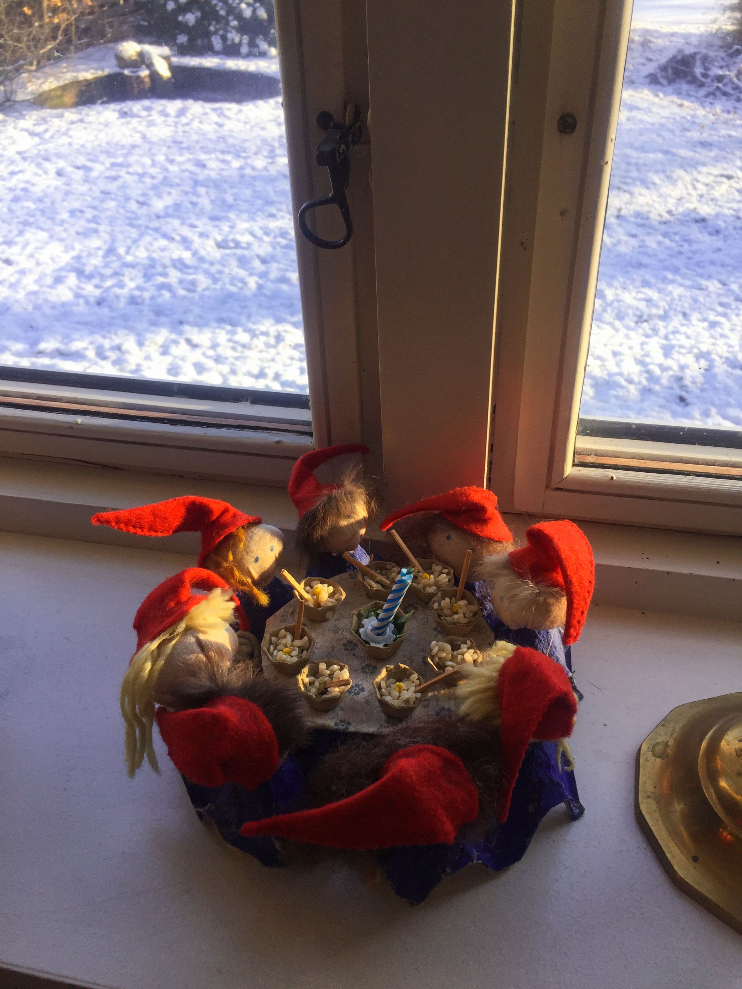 Nissen are enjoying a meal next to a window, basking in the sunlight shining upon their faces